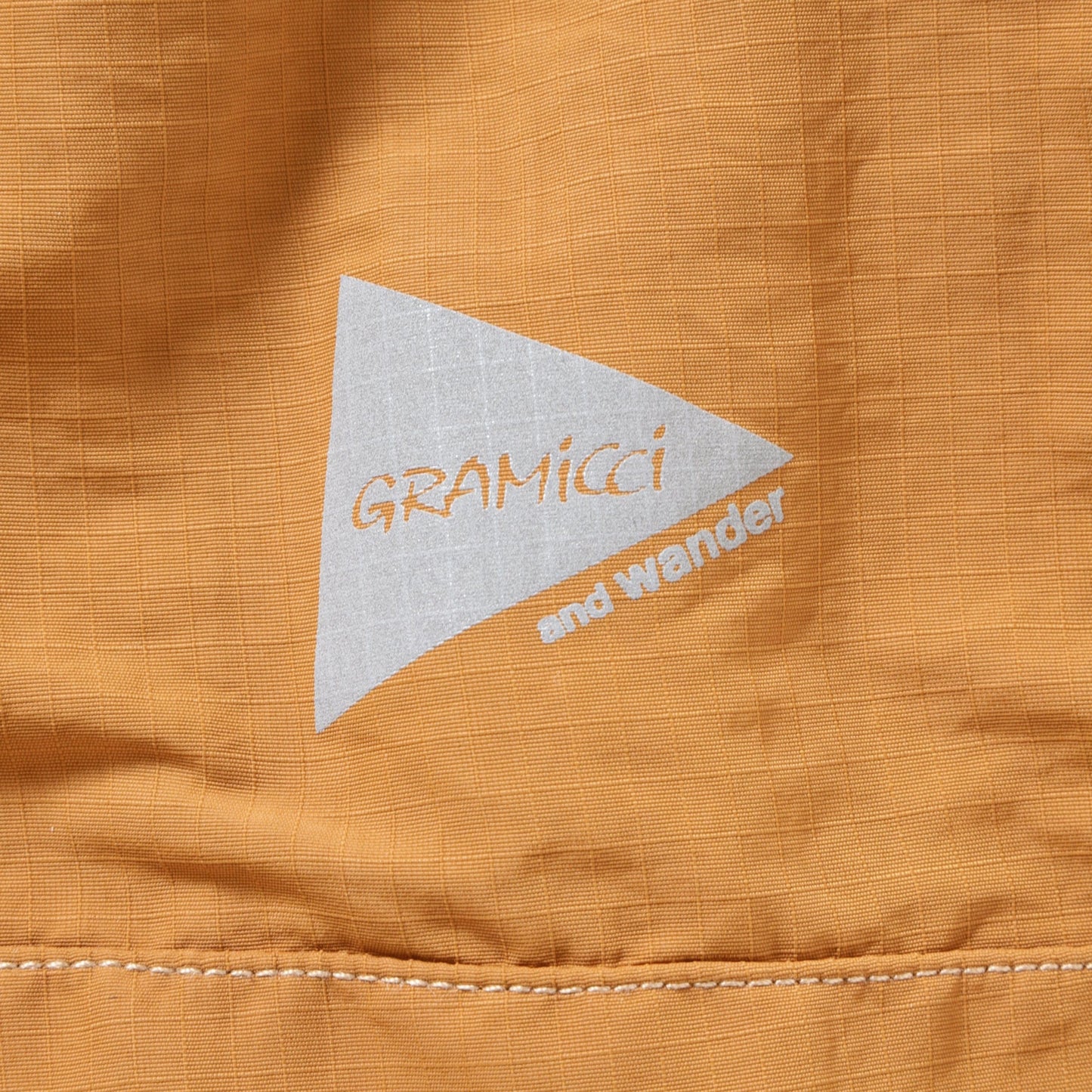 GRAMICCI X AND WANDER RIPSTOP VOYAGER PANT ORANGE