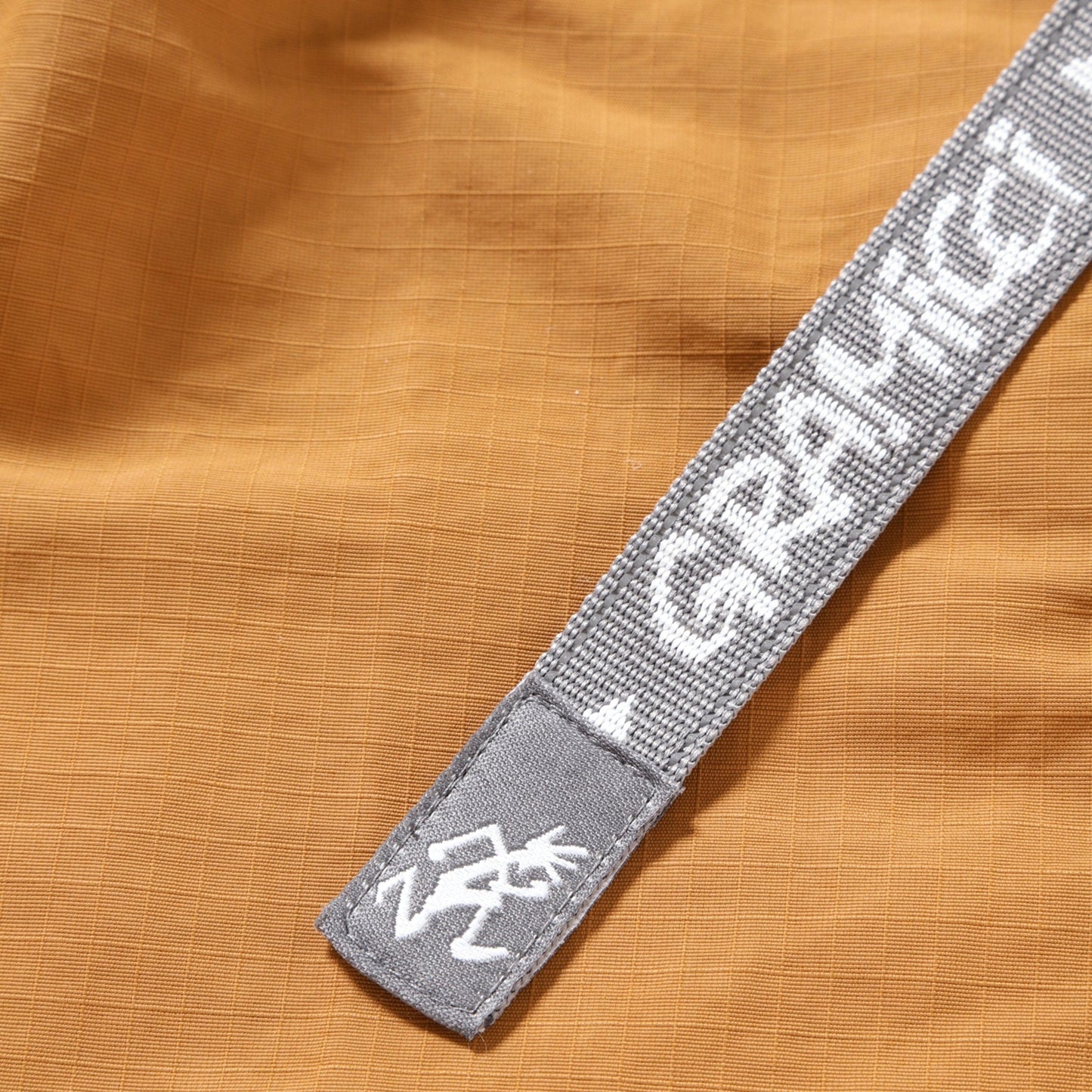 GRAMICCI X AND WANDER RIPSTOP VOYAGER PANT ORANGE