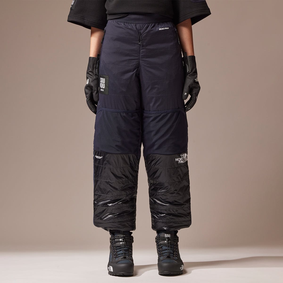 SOUKUU BY THE NORTH FACE X UNDERCOVER PROJECT 50 50 DOWN PANT TNF BLACK AVIATOR NAVY Bodega