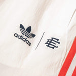 Load image into Gallery viewer, adidas Bottoms x Eric Emanuel MCD REVERSIBLE TRACK PANTS
