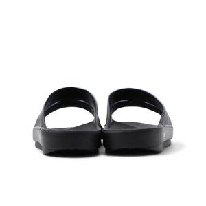 X OOFOS O Oahh Rubber Slides in Black - And Wander